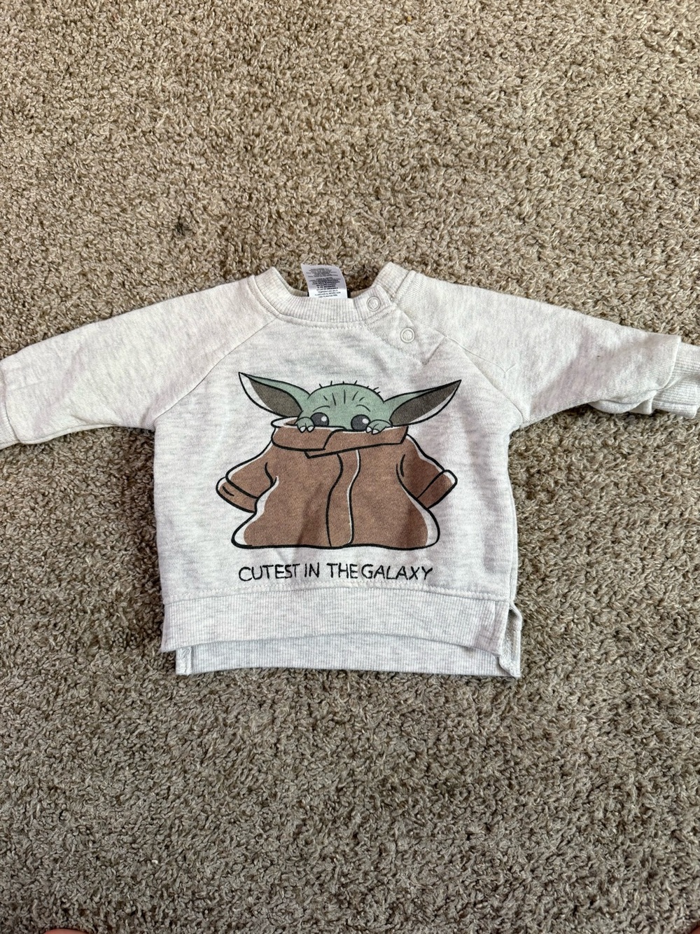 Star Wars Cream Sweatshirt with Green Grogu and Brown Coat Graphic